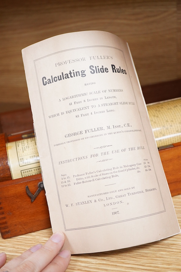 A Fuller’s Calculator, by W.F. Stanley, mahogany with a paper scale and brass cursors, mahogany cased, together with an instruction booklet, the case 35cm wide, 11cm deep, 10cm high